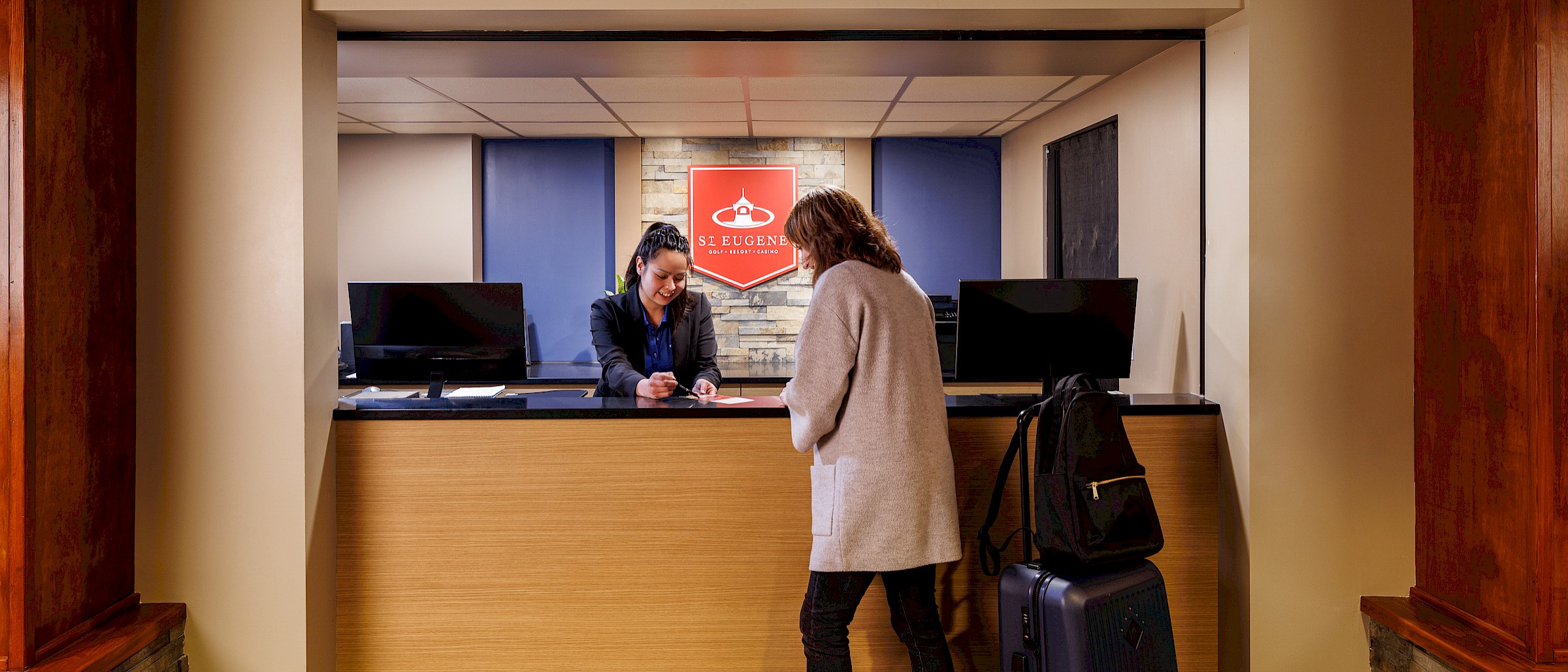 checking in at st. eugene resort front desk