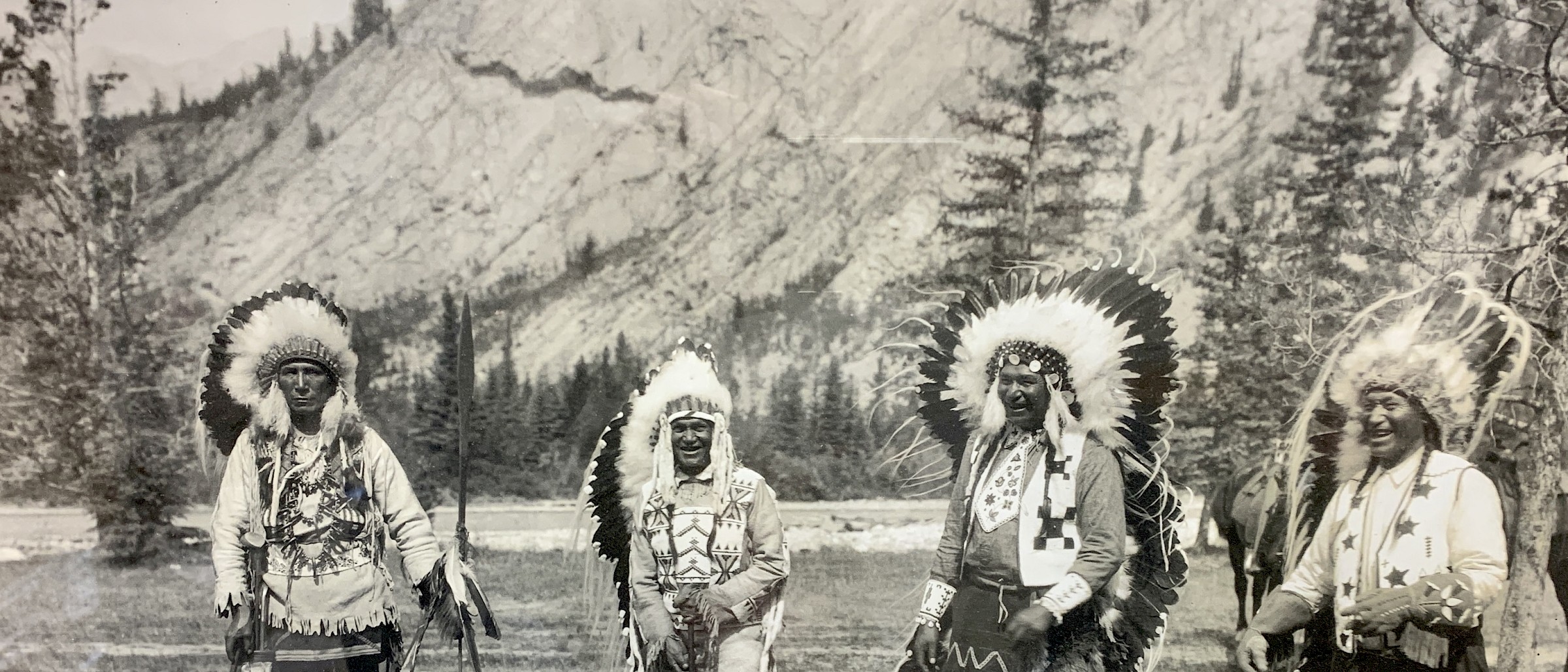 Smiling men with headdress